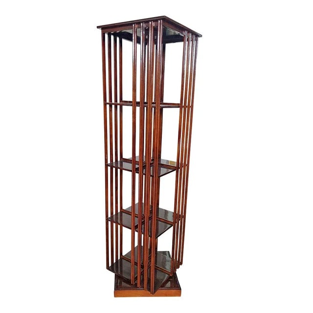 Walnut revolver bookcase with three shelves. Dimensions (wxdxh) 40.5 x 40.5 x 150 cm