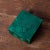 A small malachite box. 3 ¼ by 3 ⅜ by 1 ½ inches tall