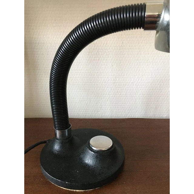 Hillebrand table lamp with cast iron base with the switch in the middle and chrome plated shade. This piece has an...