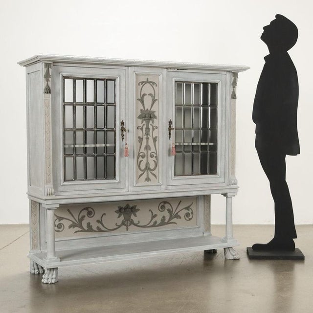 Two-door display cabinet in neo-Renaissance style from the early twentieth century. Renaissance style carvings and...