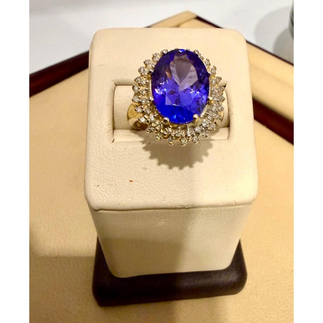 6.2 Carat Oval Tanzanite &amp; 1 Ct Diamond Ring 14 Karat Yellow Gold, Estate, Size 7 This extraordinary, 6.10 carat...