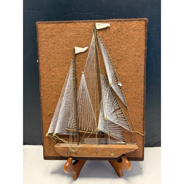 sculptural Mid-Century Modern string art wall plaque featuring a stylized sailboat regatta composition, crafted in the...