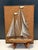 sculptural Mid-Century Modern string art wall plaque featuring a stylized sailboat regatta composition, crafted in the...