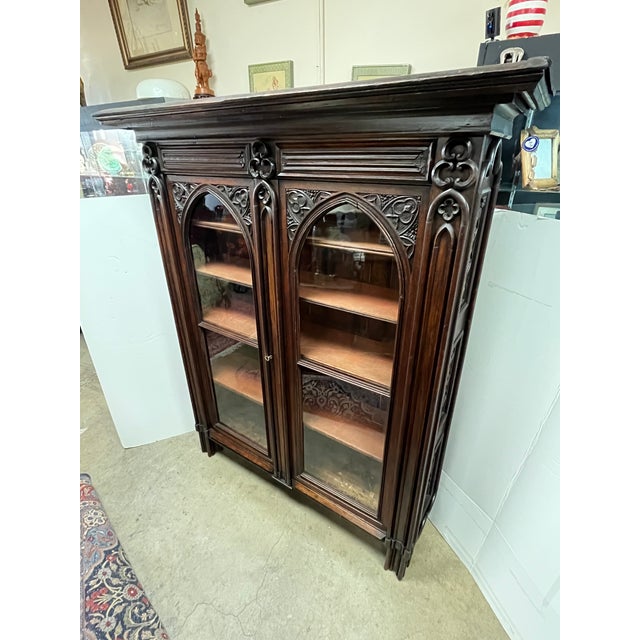 Amazing 19th Century Walnut Gothic Two Door Bookcase. All original stunning piece in amazing condition. The two large...