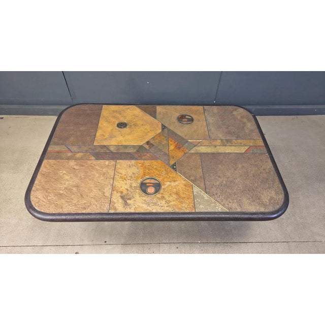 Brutalist slate and natural stone top coffee table with inlaid copper and brass. Stone base Good condition. Very much in...