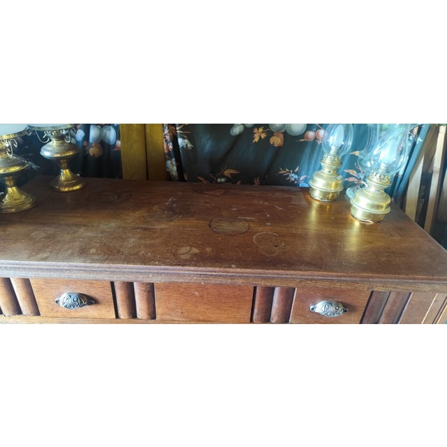Beautiful French Art Deco sideboard dating from the 1930s, crafted in richly toned oak with elegant geometric detailing...
