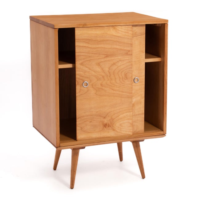 A Paul McCobb Planner Group modular two piece record cabinet consisting of a No. 1512 cabinet sitting on a No. 1540 low...