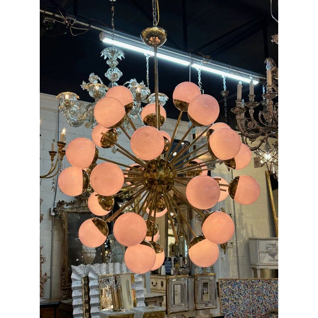 Modern Murano glass and brass pink glass globe sputnik chandelier. Circa 2000. Perfect for today's transitional designs!