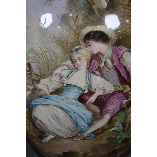Standing an extraordinary 39 inches tall, this monumental Sevres-style porcelain covered vase is a breathtaking example of...