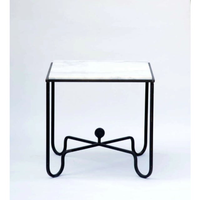 The “Entretoise” Wrought Iron and Marble Tables. Blackened wrought iron bases with honed (matte finish)Carrara marble tops.