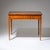 Rectangular Biedermeier table raised on tapered square legs, featuring fine string inlay framing the apron and tabletop. A...