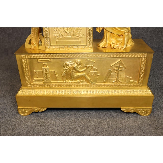This magnificent French gilt metal figural mantel clock is a striking example of the refined artistry and technical...