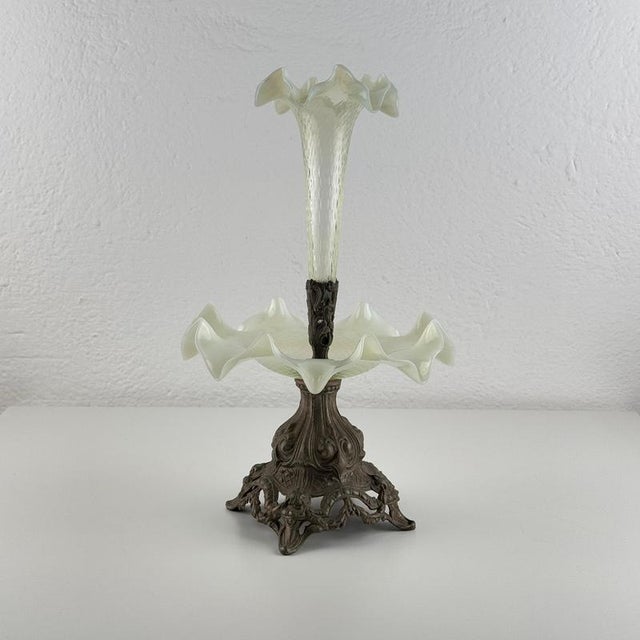 A charming and beautifully preserved Art Nouveau epergne, combining delicate opalescent glass with an intricately cast...