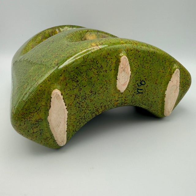 This vase dates from the 1970s and showcases Bertoncello's signature sculptural style, featuring organic cutouts and a...