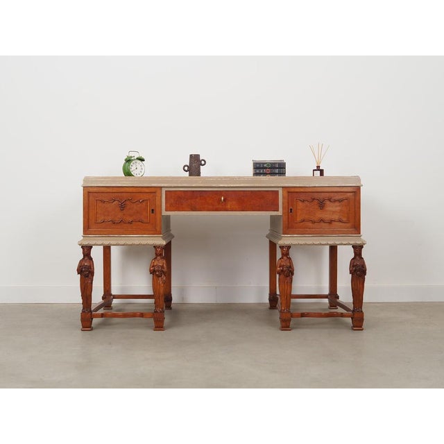 The desk was made in the 1950s, Danish production. The top was covered with oak veneer. The legs are made of solid oak....