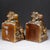 ABOUT A pair of Art Deco cast metal bookends, commonly known as the "Take A Peek With Me" model. They feature an...