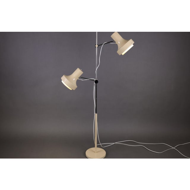 This elegant and highly adjustable vintage floor lamp, designed by the renowned Czech designer Josef Hurka for Napako,...