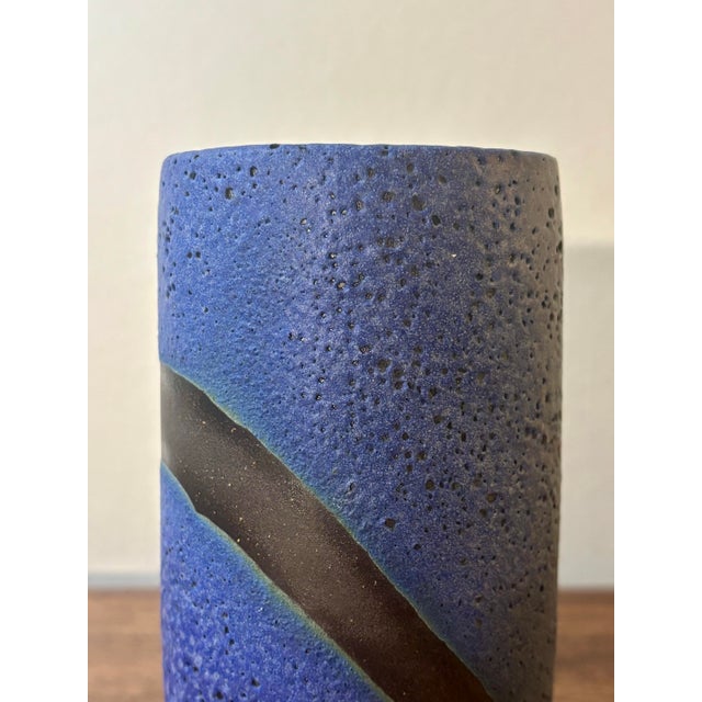 A striking American mid-century modern studio ceramic vase featuring a rich cobalt blue lava glaze contrasted by a smooth...
