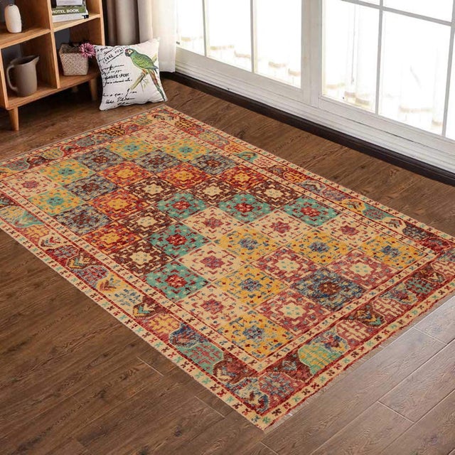 This stunning hand-knotted Afghan Balouchi rug is a captivating addition to any decor. Crafted by skilled artisans, it...