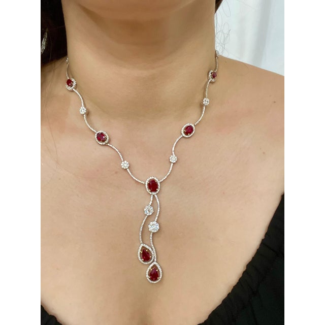 This Necklace made out of 18 Karat white gold . Necklace consisting of 2 Pear shape and 5 Oval shape natural Burma ruby...