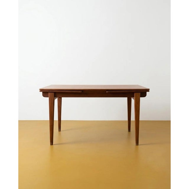 Vintage 1960s Danish teak table, extendable from 140 to 250 cm with double butterfly extensions and rounded corners....