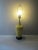 A beautiful yellow ceramic lamp with raised flowers and a black ceramic base. The lamp has no cracks, chips,etc. There is...