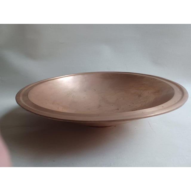 Esa Fedrigolli's bronze sculpture, 41 cm in diameter and 11 cm tall, is a work of great visual and symbolic power....