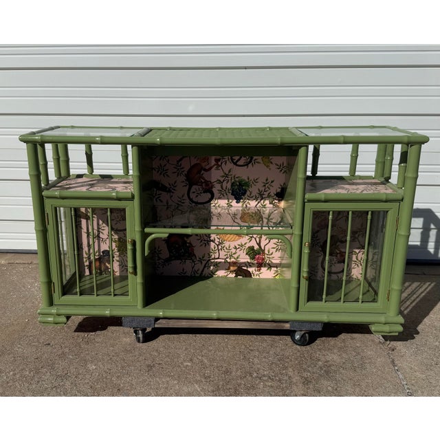 How Golden Girls is this entertainment center/ bar? We couldn't resist the wallpaper! This beautiful bamboo and rattan...