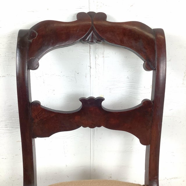 This vintage Chippendale style side chair showcases the timeless elegance of one of history’s most enduring furniture...