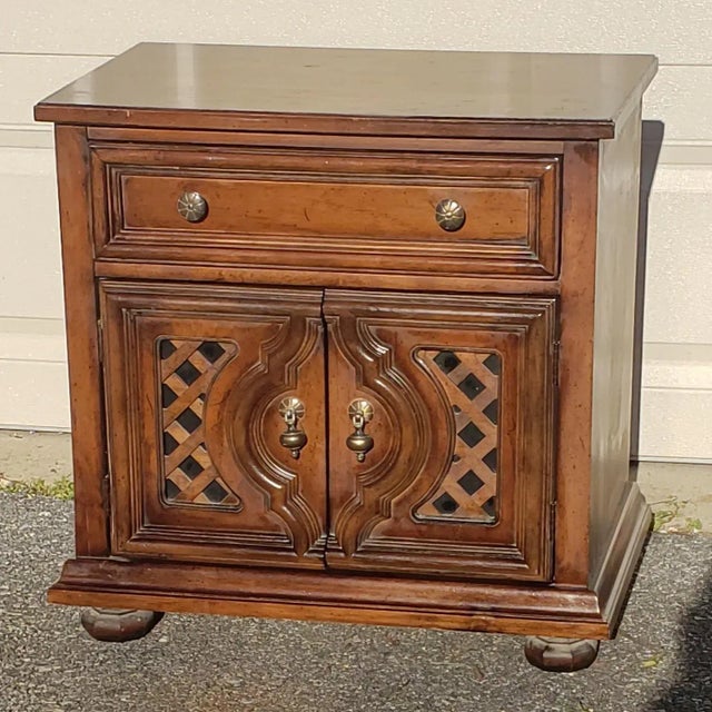 Amazing vintage wooden nightstands/end table. Features a drawer and cabinet section with brass handles.