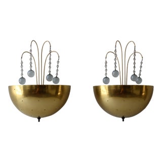 1940s Pair of Mid-Century Brass Sconces With Pierced Star Shades and Crystal Drops in the Manner of Paavo Tynell For Sale