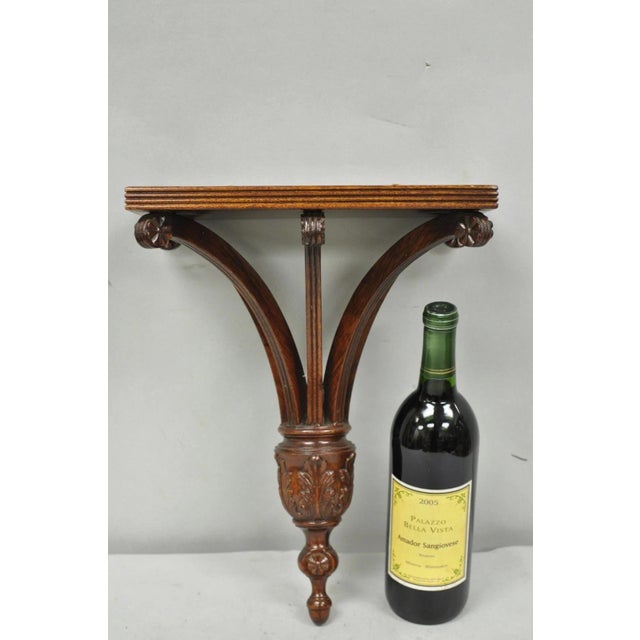 Regency Style Mahogany Plume Prince of Wales Carved Wall Mount Bracket Shelf. Circa Late 20th Century. Measurements: 15.5"...