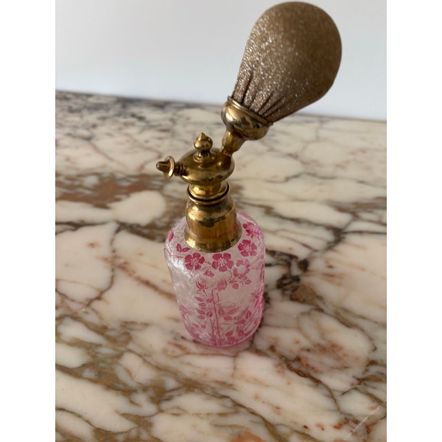 Stunning Baccarat cranberry to clear acid etched perfume bottle with gold mesh atomizer. It has a textured leaf pattern...