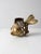 This mid-20th-century brass fish figure features a whimsical and imaginative design. The openwork body, fashioned to...