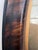 Antique Victorian photograph features a man with a distinct handlebar mustache and tinted tie, housed in an oval wood-...