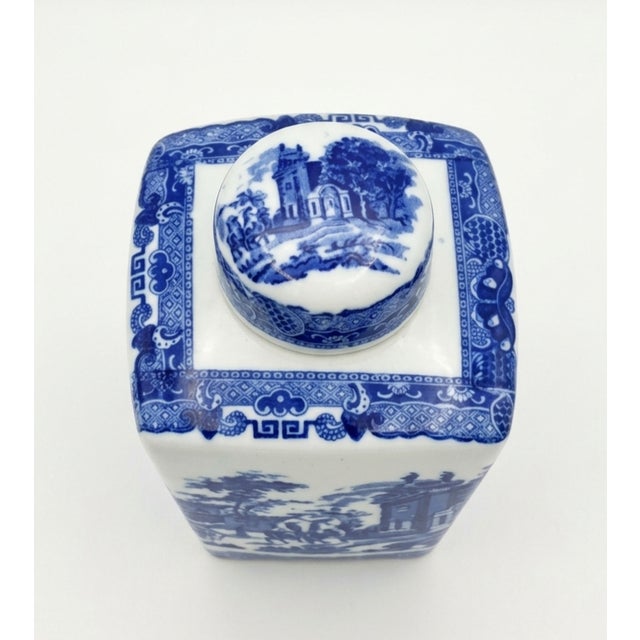 Elevate your mantle, bookshelf, or kitchen vignette with this timeless vintage blue and white square tea caddy. Made from...