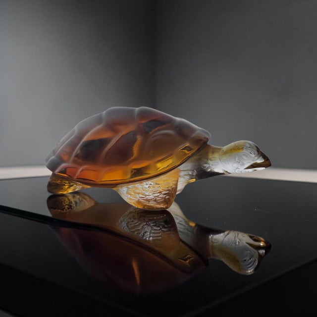 This Lalique Tortue Caroline crystal turtle, model #116390, was handcrafted in France between 1978 and 1999. Executed in...