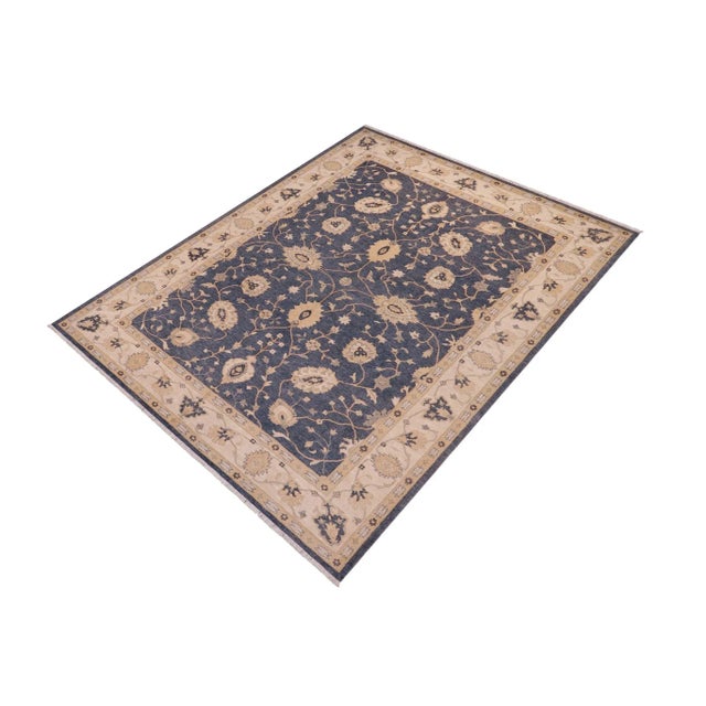 "Enhance the ambiance of your home with this magnificent Persian-influenced Turkish hand-knotted rug made by skilled...