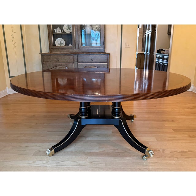 Handmade in Sussex, England by Trosby in 2000, this extraordinary 72” round dining table features a 2” reeded edge,...