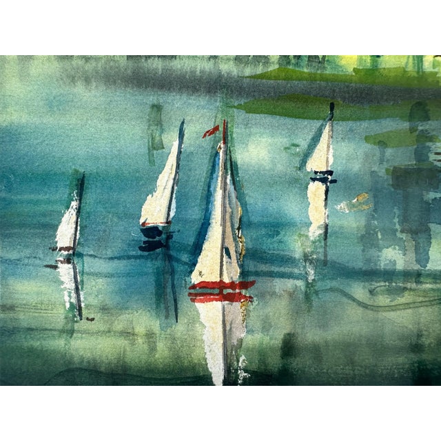 A brilliantly colored watercolor of boats on the water with a hilly forest and bright sky in the background.
