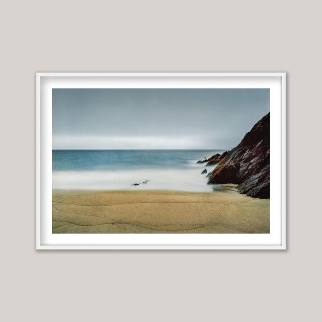 An early-morning photograph of Coumeenoole Strand, the remarkable beach on Ireland’s Dingle Peninsula. Made with a long...