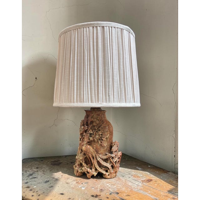 This is an exceptional antique lamp, hand carved of soapstone, richly textured in a rose, tan and cream tint. The carvings...