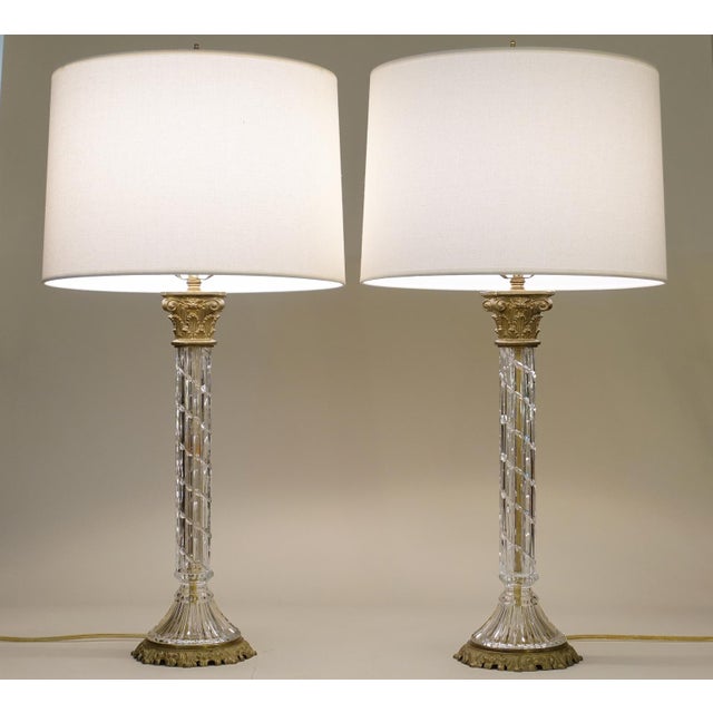A bold and impressive matched pair of vintage Neoclassical French Empire Crystal & Brass stylized Corinthian Column table...