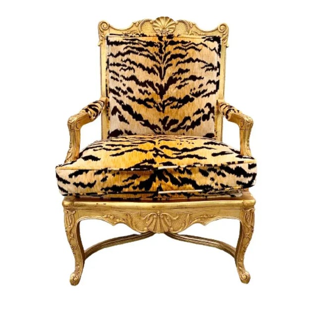 A stunning French Regency style armchair Early 20th Century Hand carved gilt wood frame, with down filled cushion, and...