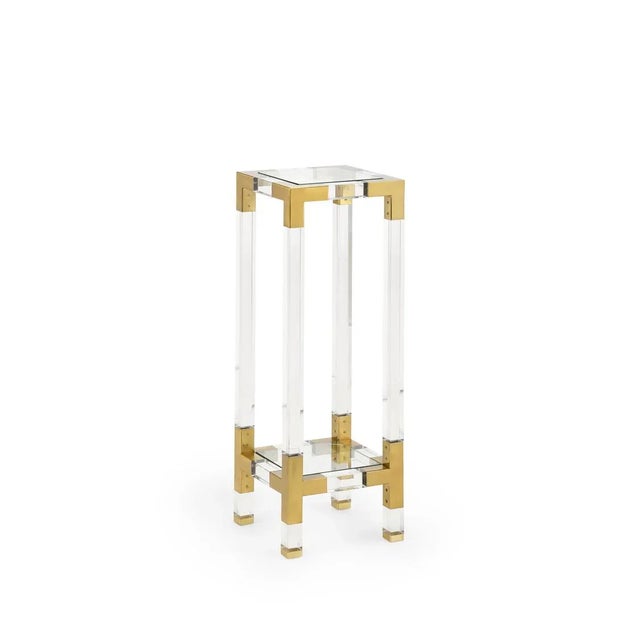 Clear Acrylic And Antique Brass Finished Pedestal With Two Tempered Glass Shelves. Clean with a dry cloth