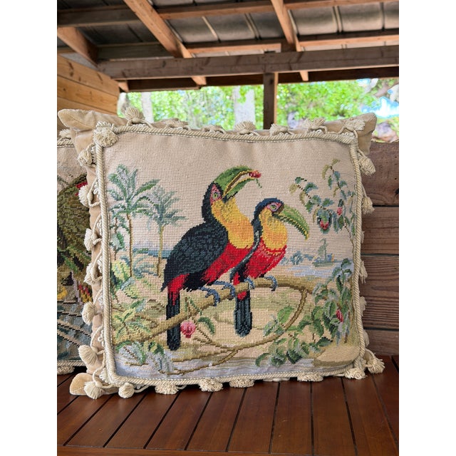 A charming and increasingly hard-to-find pair of vintage hand-needlepoint pillows featuring vibrant tropical bird scenes....