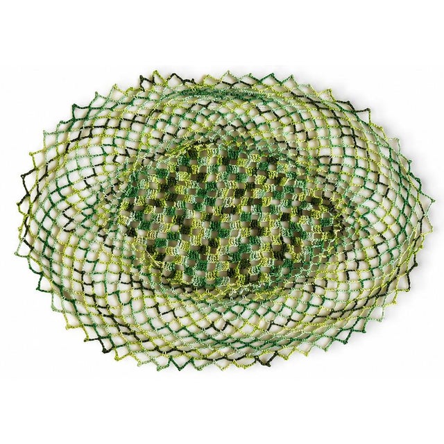 Hand-tatted placemats Set of eight. Open lacework in layered greens with a woven center and scalloped edge. Beautiful with...