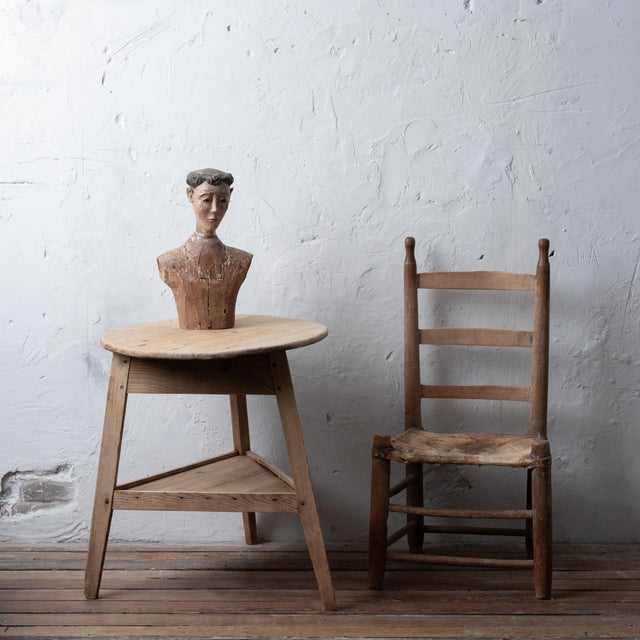 A carved and polychromed tonsured saint figure, 18th century. Glass eyes and formerly with articulating arms. 10 ¼ inches...