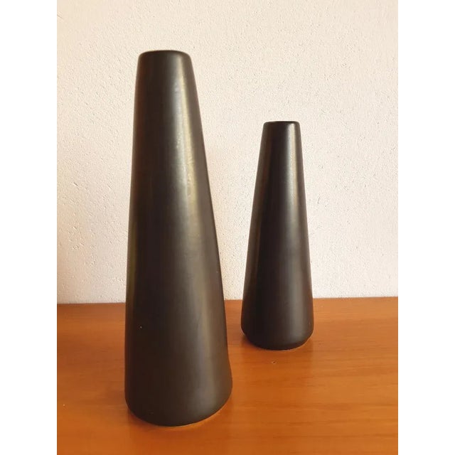 These geometric vases were designed by Jan Bontjes van Beek. They feature a black matte glaze. The smaller vase measures H...