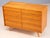 A classic vintage czech chest of drawers, model u-453, designed by jiří jiroutek in the 1960s. The cabinet features a warm...